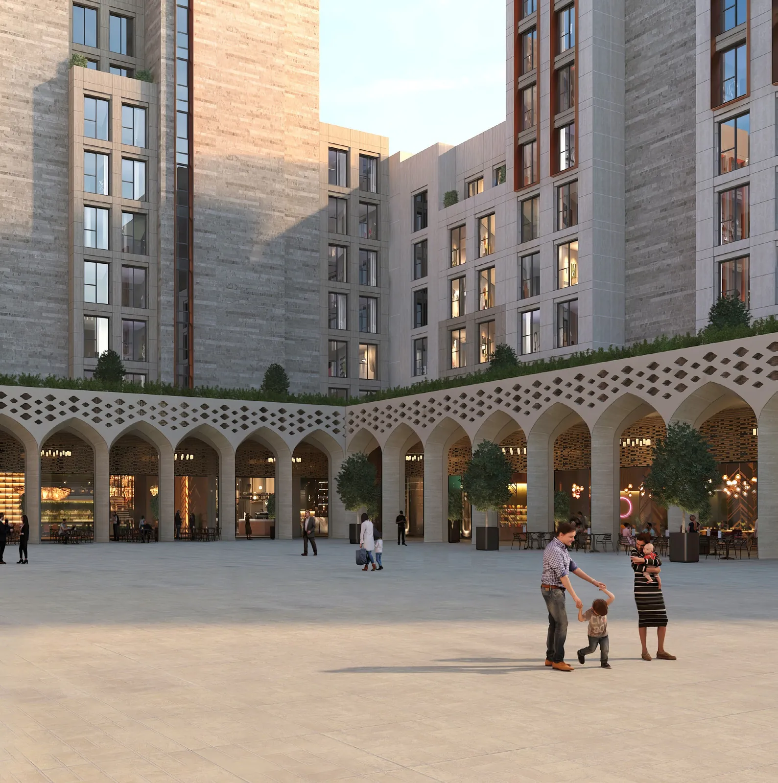 Family walking across a paved courtyard with an arcade and apartment blocks