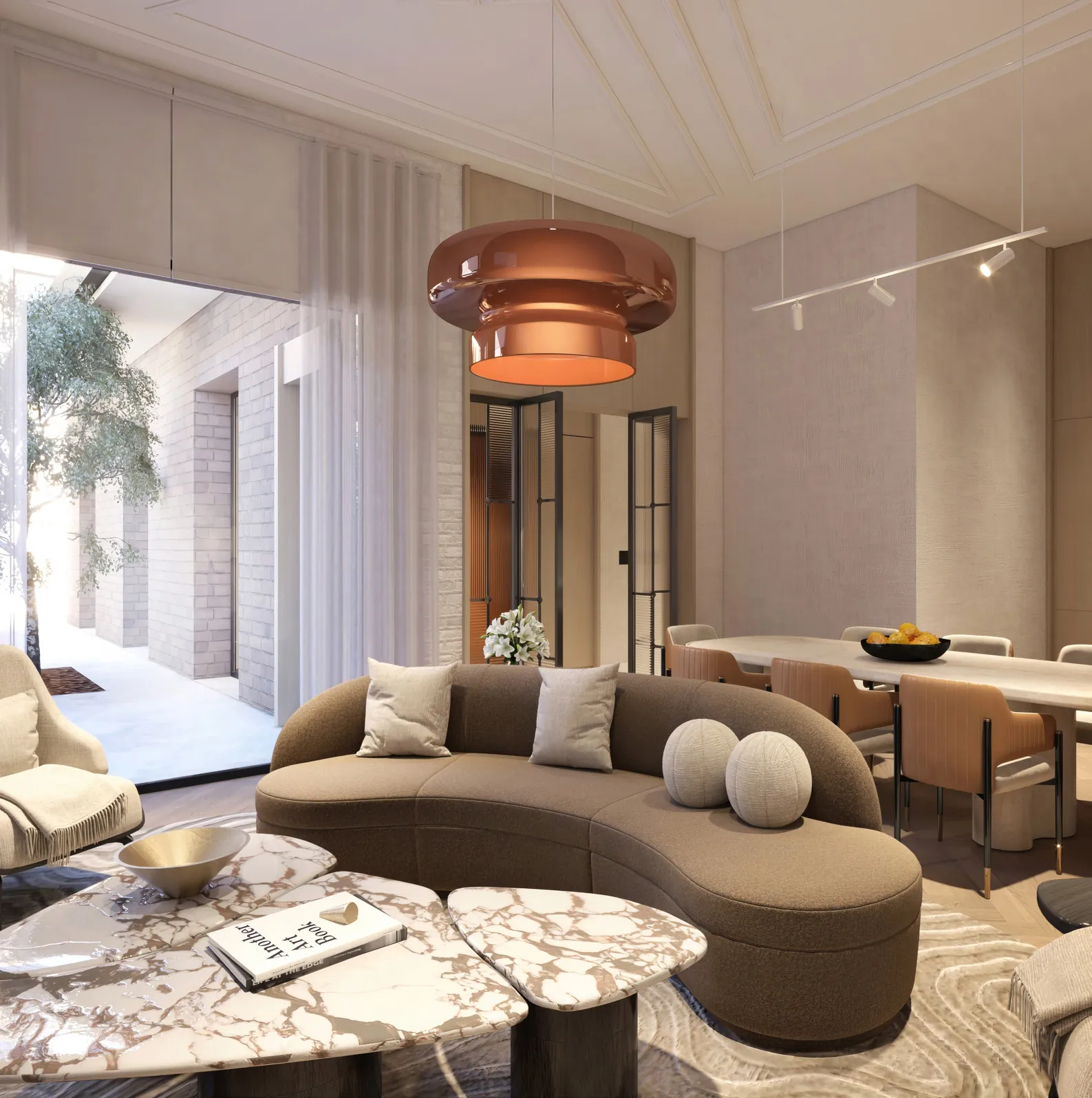 Lounge with a curved sofa, copper pendant light and marble coffee tables