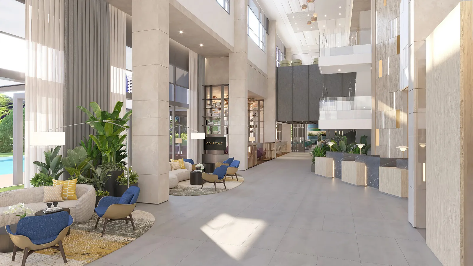 Tall hotel atrium lobby with seating groups and plants